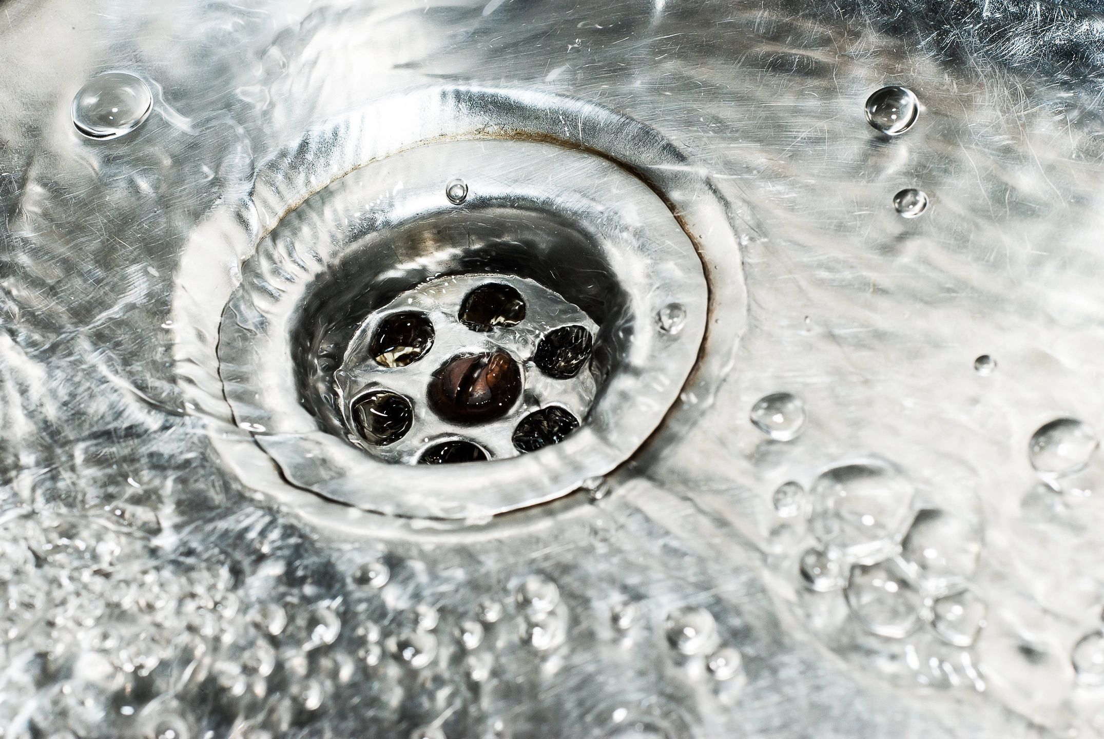 Clear water in a stainless steel sink