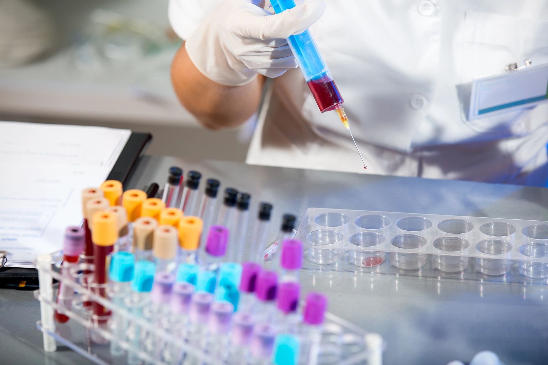 Person putting blood into vials