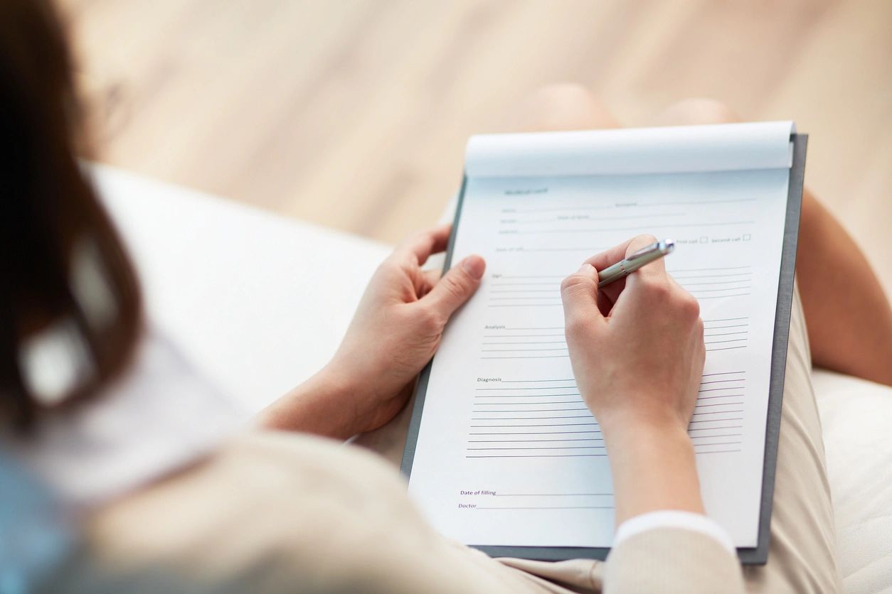 Ariel shot of someone taking notes or completing paperwork