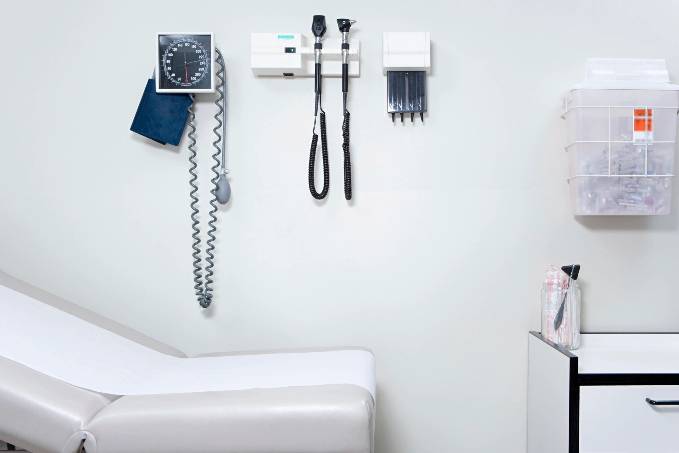 Exam room with vitals equipment on wall